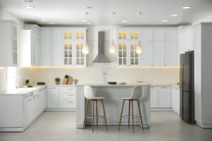 A beautiful modern kitchen with white cabinets.