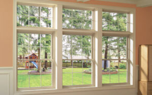 Gorgeous double-hung windows with a view into a beautiful backyard