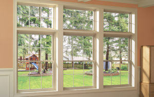 Three double-hung windows look out to backyard 