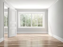 Wide window letting natural light into an empty room