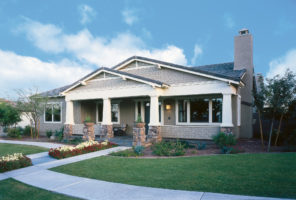Picture of a house with gray James Hardie siding.