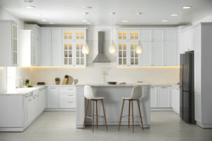A luxury kitchen with white cabinetry and a large island.