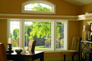 Large picture windows in a home office.