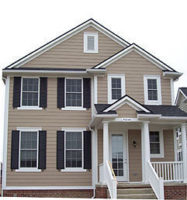 Full view of light brown siding on the front of a home