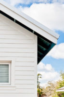 Close-up view of white siding on a house