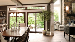 A sliding glass door with wood frame in a kitchen.